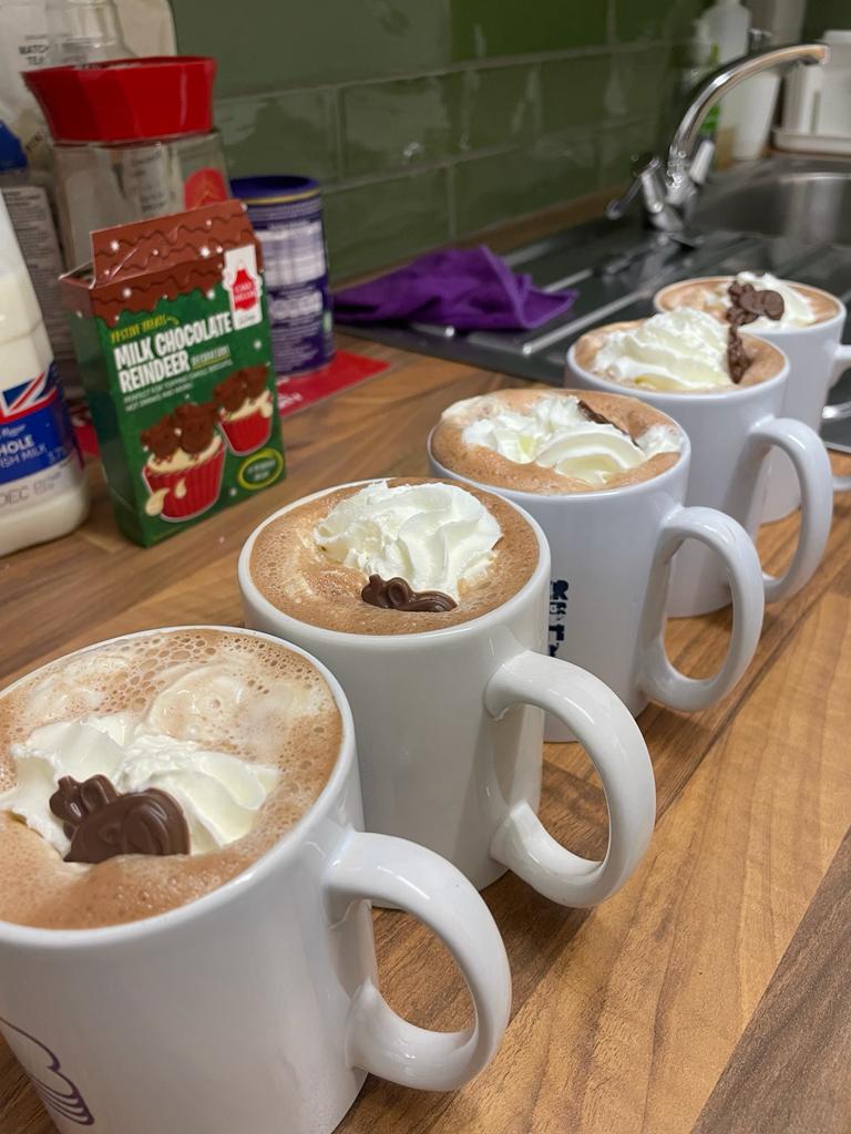 4 hot chocolates lined up next to eat other